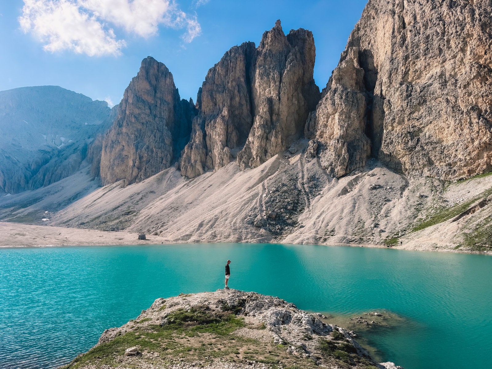 Alone by an alpine lake in the Dolomites